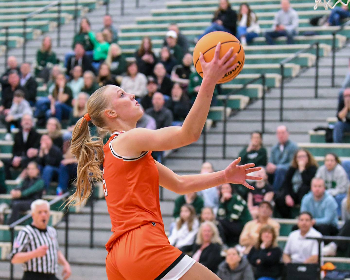 St. Charles East's Brooklyn Schilb (5) makes a layup while taking on Glenbard West during the 4A Sectional championship game on Thursday Feb. 26, 2026, held at Bartlett High School.