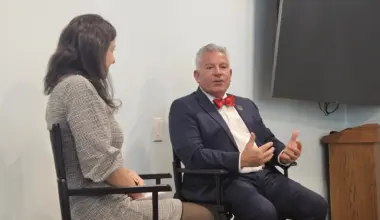 Administrative Judge Joseph Zayas speaks with Queens County Bar Association President Kristen Dubowski-Barba about the need to hire more judges in the state. Photo: Noah Powelson/Eagle Urban Media