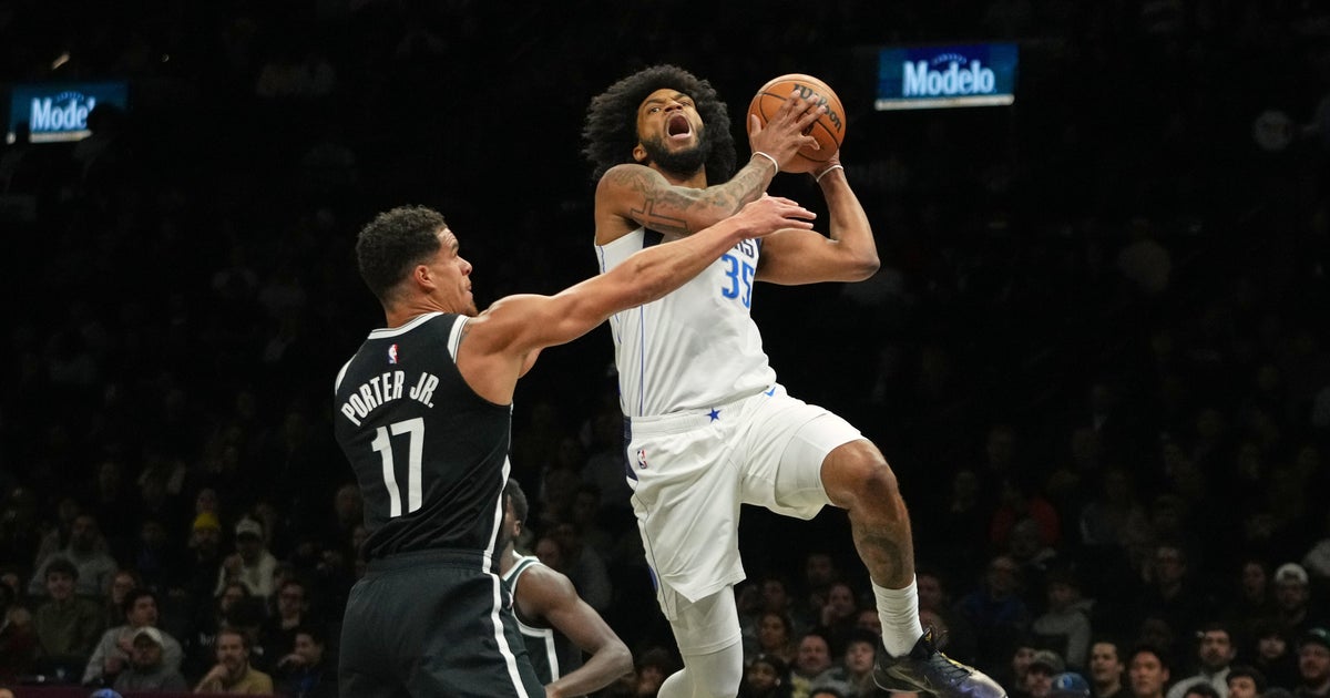 Mavericks beat Nets 123-114 after both teams arrive on game day because of blizzard
