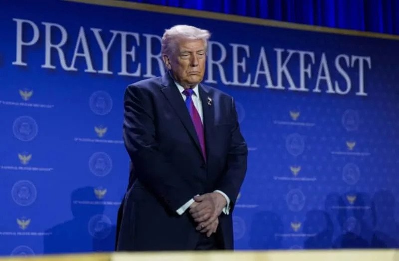US President Donald Trump prays during a group prayer during the National Prayer Breakfast in Washington, DC, US, February 5, 2026. (credit: REUTERS/Al Drago)
