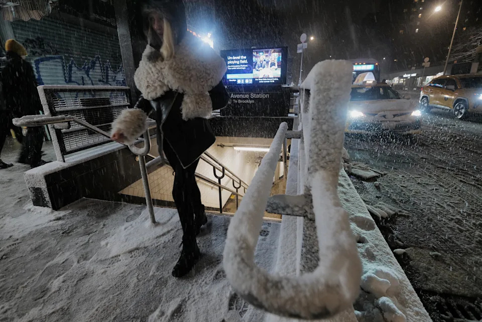 Subway station as snow falls in the Alphabet City neighborhood of New York<span> Credit: Patrick Sison, AP</span>