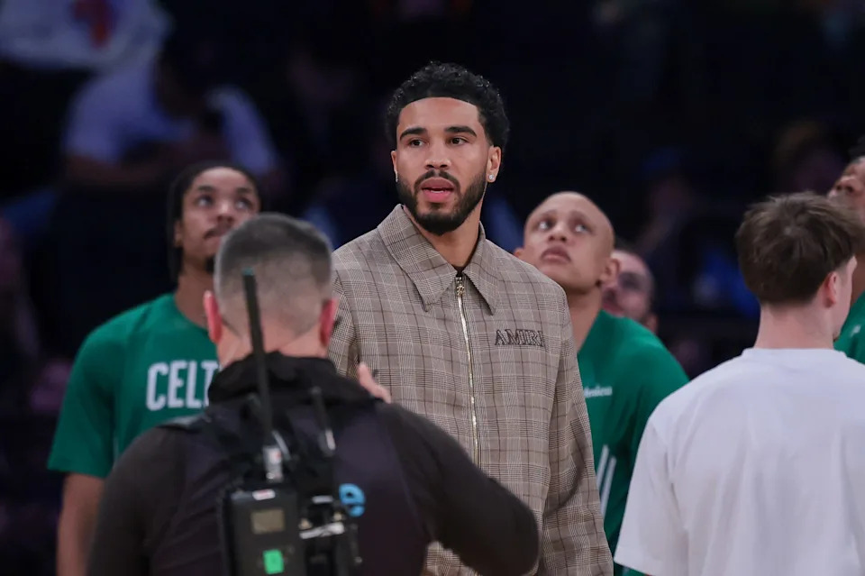 Oct 24, 2025; New York, New York, USA; Boston Celtics guard Jayson Tatum, center, looks on during the fourth quarter against the New York Knicks at Madison Square Garden. Mandatory Credit: Vincent Carchietta-Imagn Images