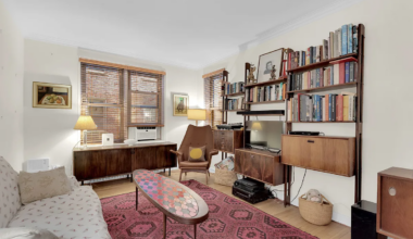 living room with wood floor, two windows