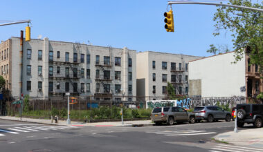 chain link fence surrounding the lot that once held the ornate dangler mansion