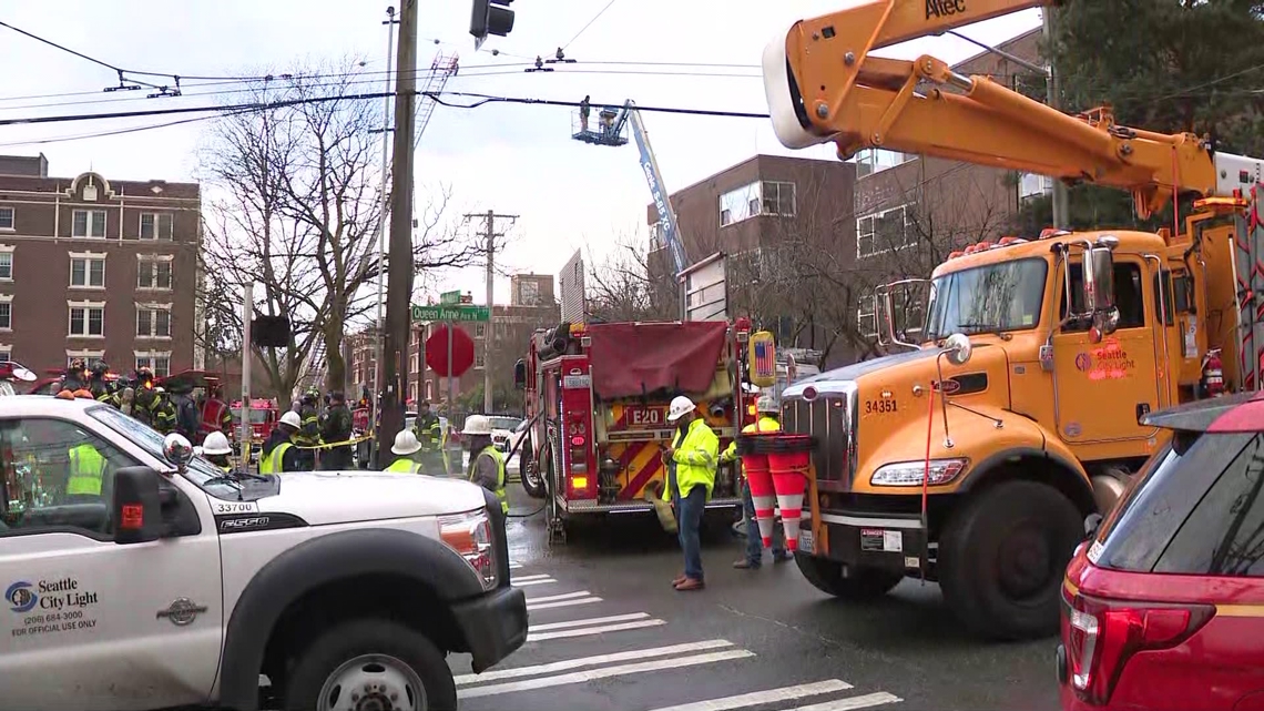 Operator rescued after crane crashes into power pole in Queen Anne