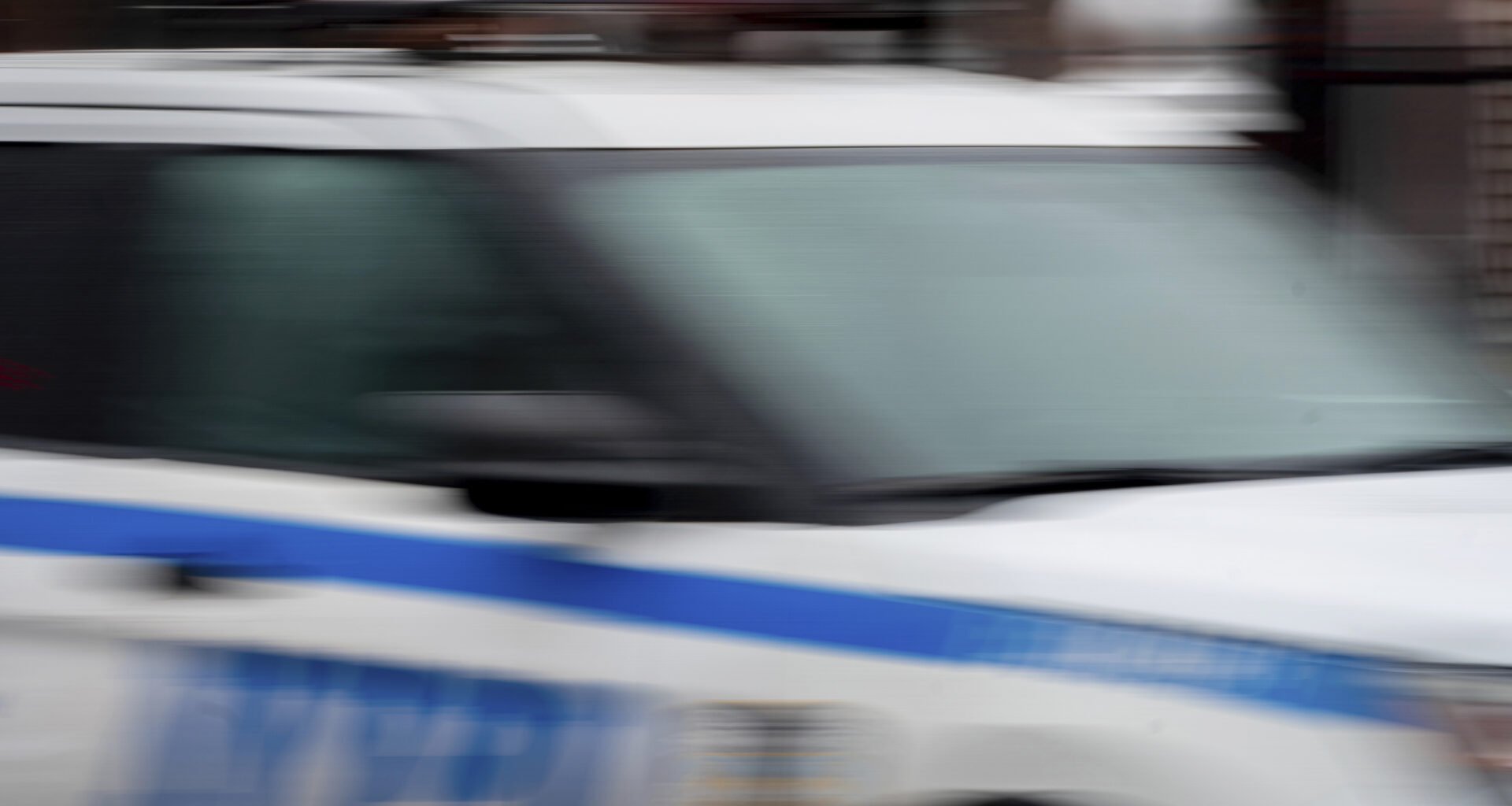 FILE - A police car drives through the Brooklyn borough of New York, Dec. 16, 2022. (AP Photo/Julia Nikhinson, File)