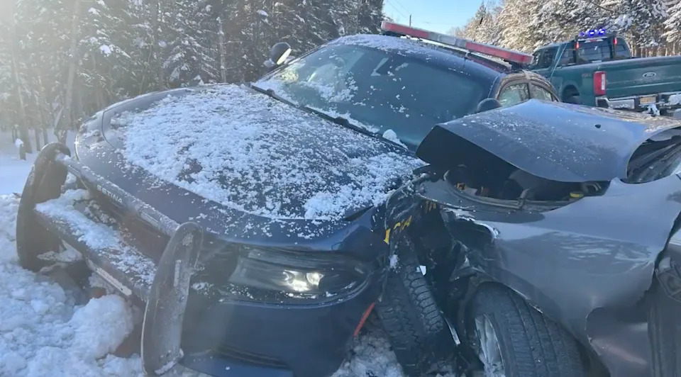 A driver's vision was impaired by the sun and collided with a New York State Police cruiser.