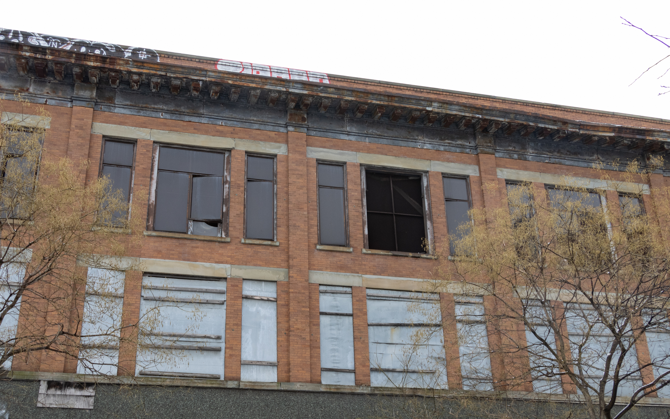 broken and boarded up windows