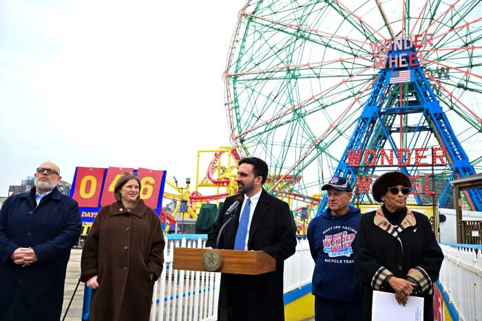 people at a podium in an amusement park 