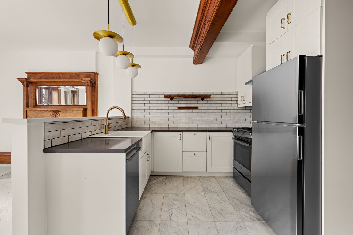 apartment kitchen with white cabinets, stainless steel appliances