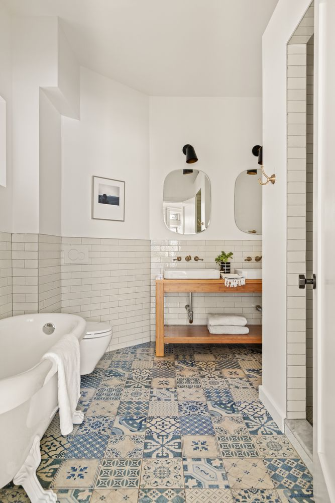 bathroom with mult-patterned tile floor
