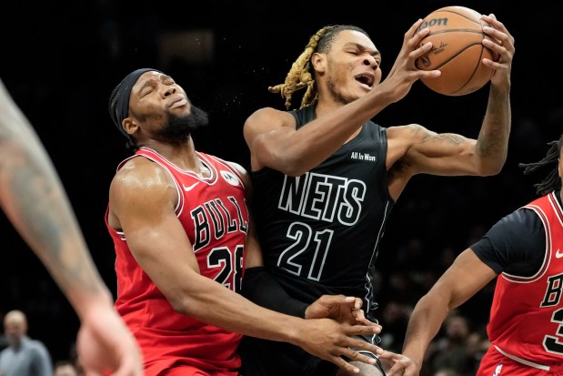 Brooklyn Nets forward Noah Clowney is hit by Chicago Bulls forward Guerschon Yabusele, left, during the first half on Monday, Feb. 9, 2026, in New York. (AP Photo/Yuki Iwamura)