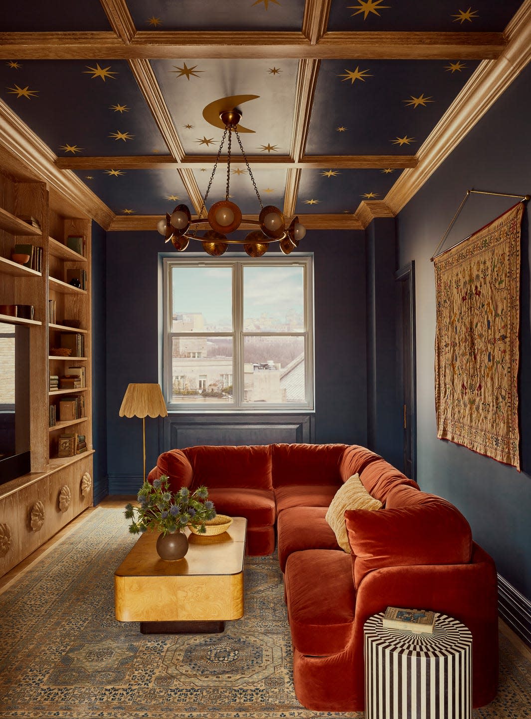 Stylishly designed living room with cozy seating and decorative elements.