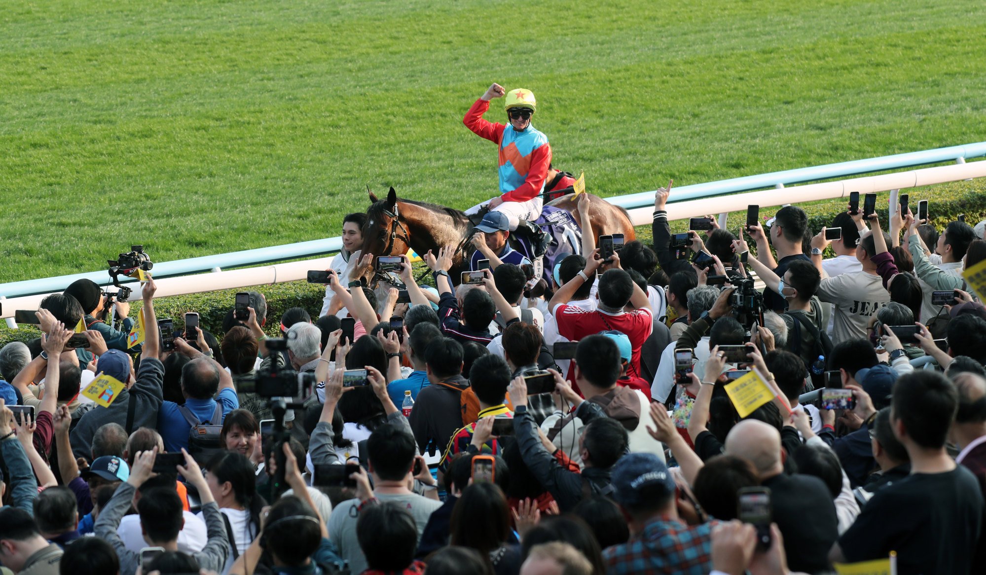 Zac Purton and Ka Ying Rising soak up the attention from Sha Tin fans after his win.