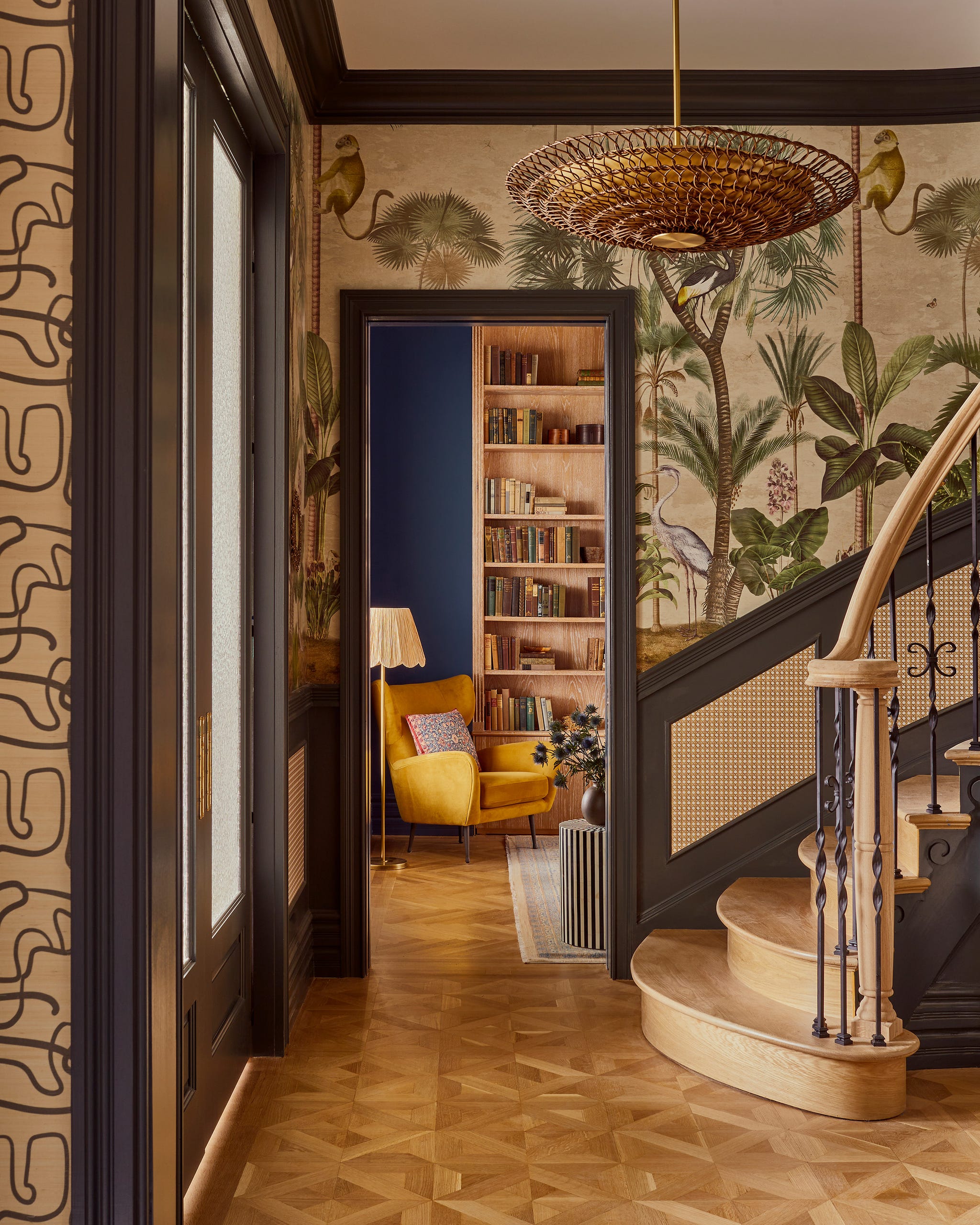 Interior hallway leading to a cozy reading area and staircase.