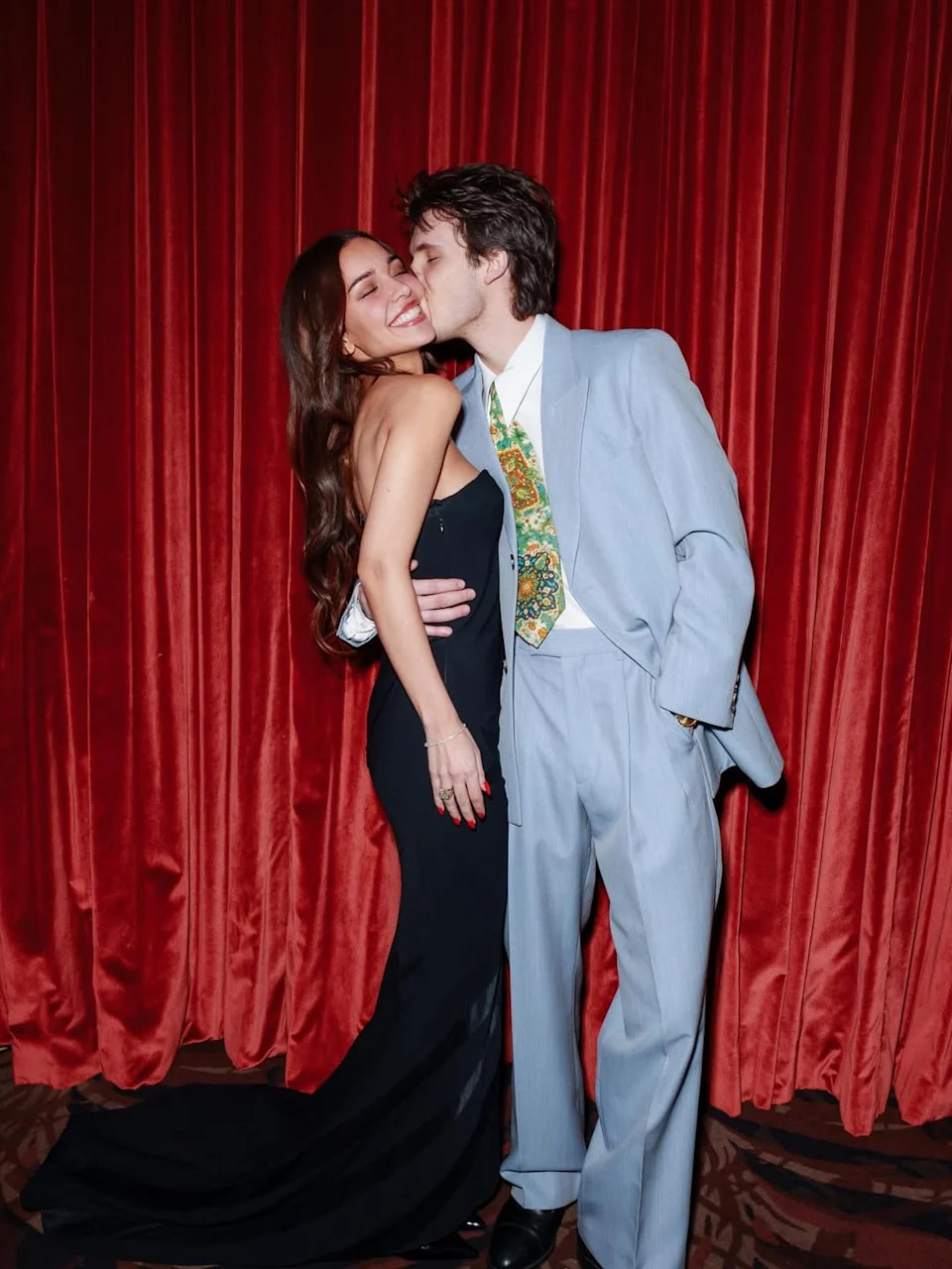 Cruz planted a kiss on his much-older girlfriend, Jackie Apostel. Victoria Beckham / Instagram