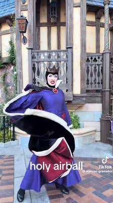 The Evil Queen at Disneyland swirling around in her cloak.