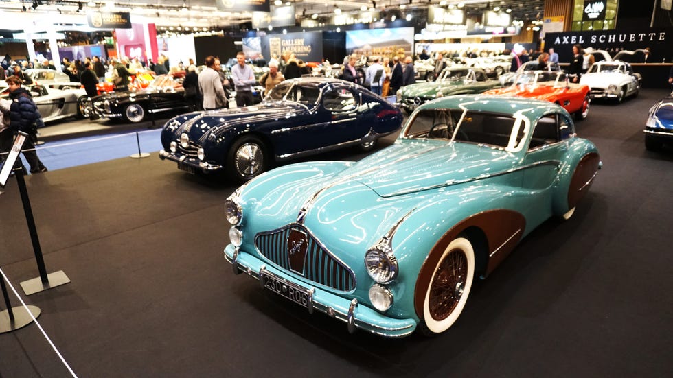 classic car exhibition with multiple vintage cars displayed