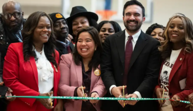 people getting ready to cut a ribbon