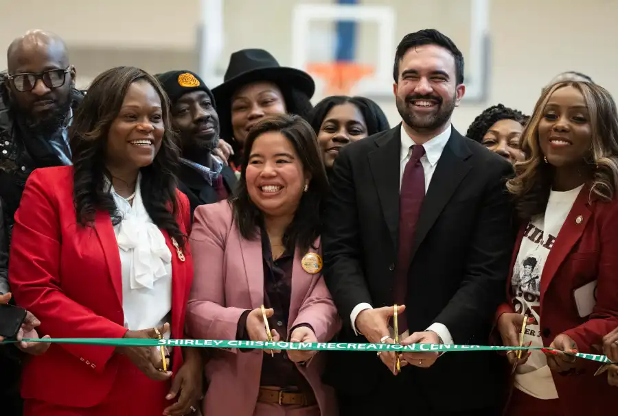 people getting ready to cut a ribbon