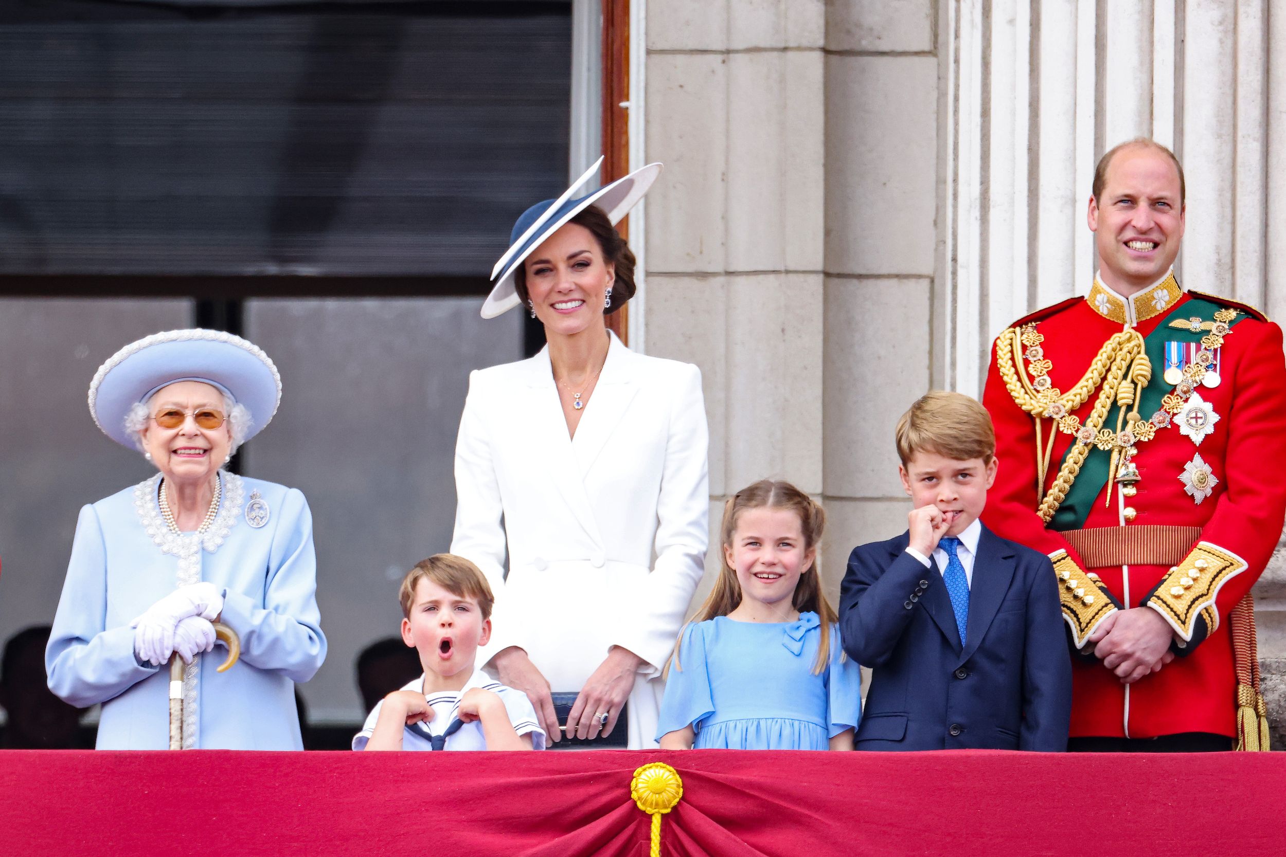Queen Elizabeth II and the Wales family watch the RAF flypast on the balcony of Buckingham Palace during the Trooping the Colour parade in 2022