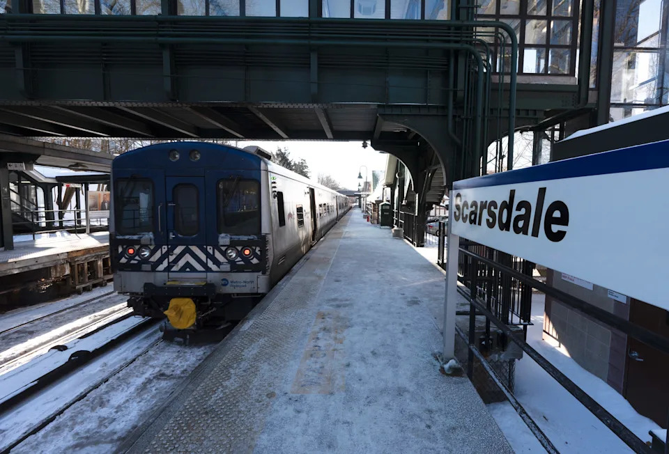A New York City bound Metro-North train leaves the Scarsdale train station Jan. 28, 2026. Earlier in the morning, a passengers were evacuated from a train at the Scarsdale station after a mechanical issue cause a fire under a train car.