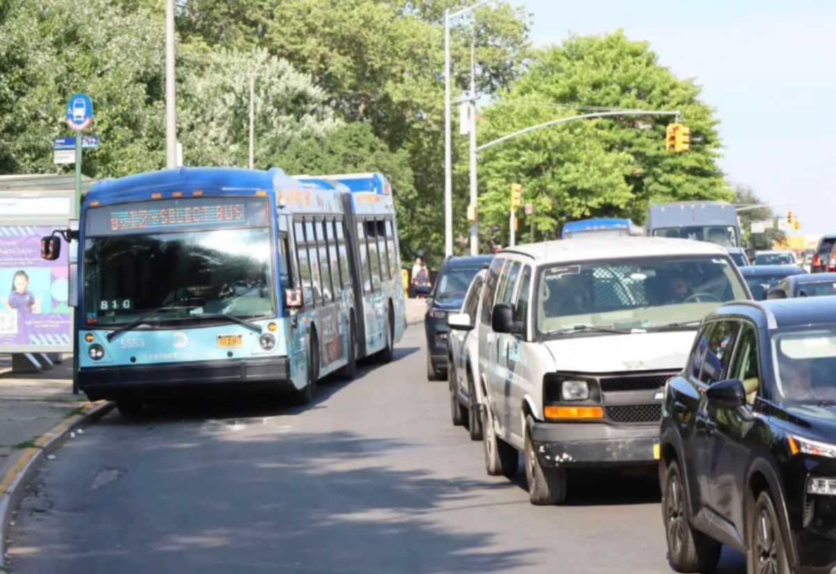 Bus moves slowly on Fordham Road in the Bronx