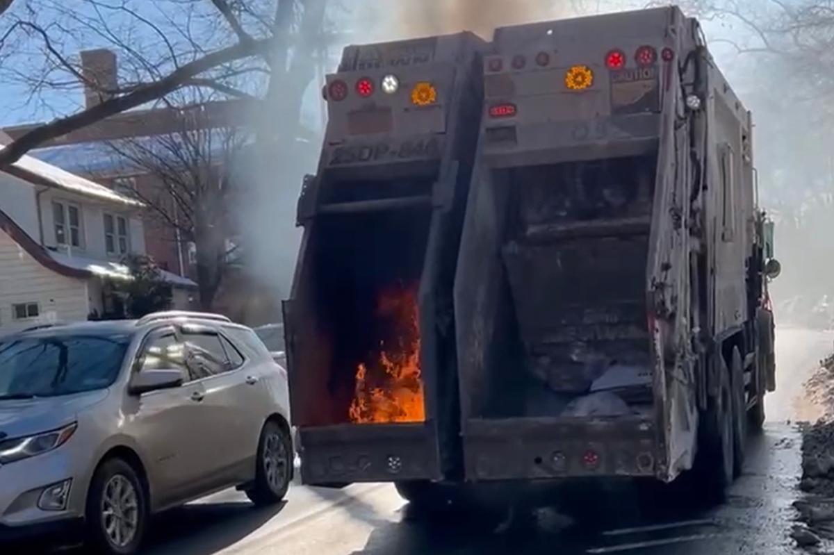 Wild video shows NYC garbage truck literally on fire in middle of snow-packed Queens street