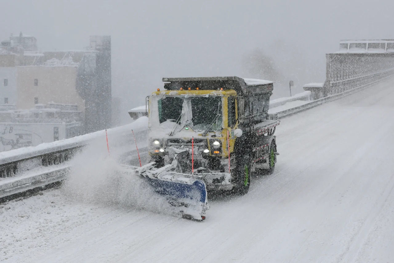 A snowplow crosses the Brooklyn Bridge during a winter storm in New York City on Feb. 23. 