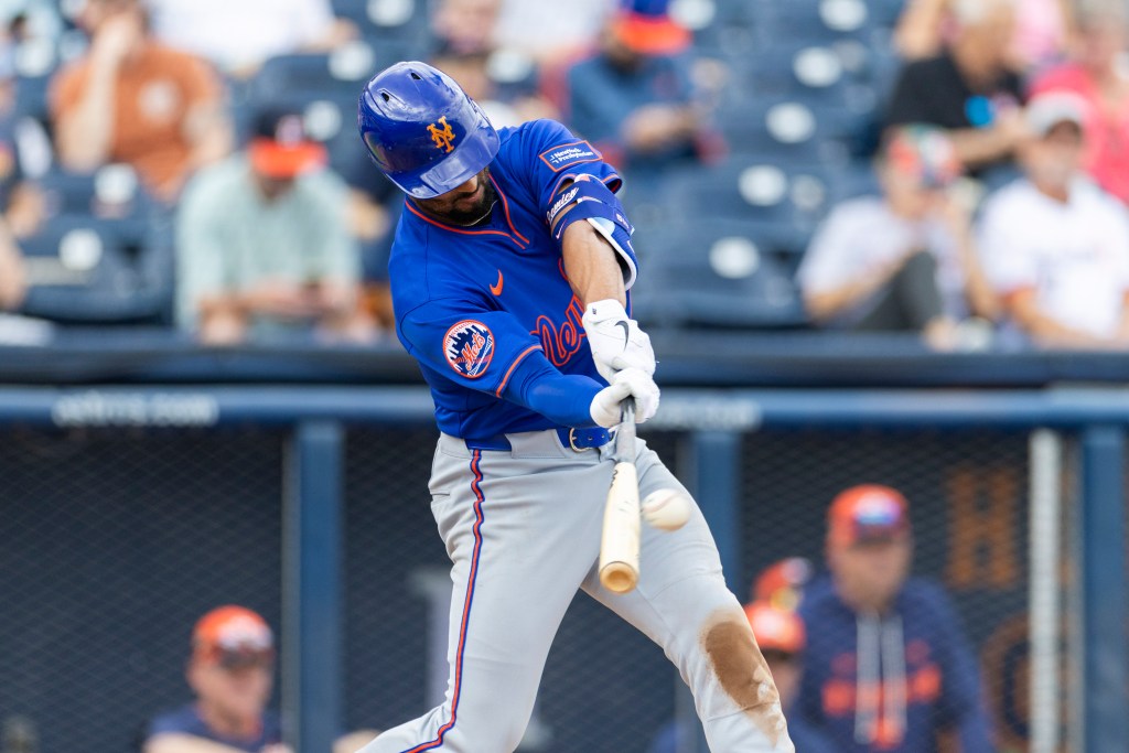 New York Mets' Marcus Semien hitting a solo home run during Spring Training.