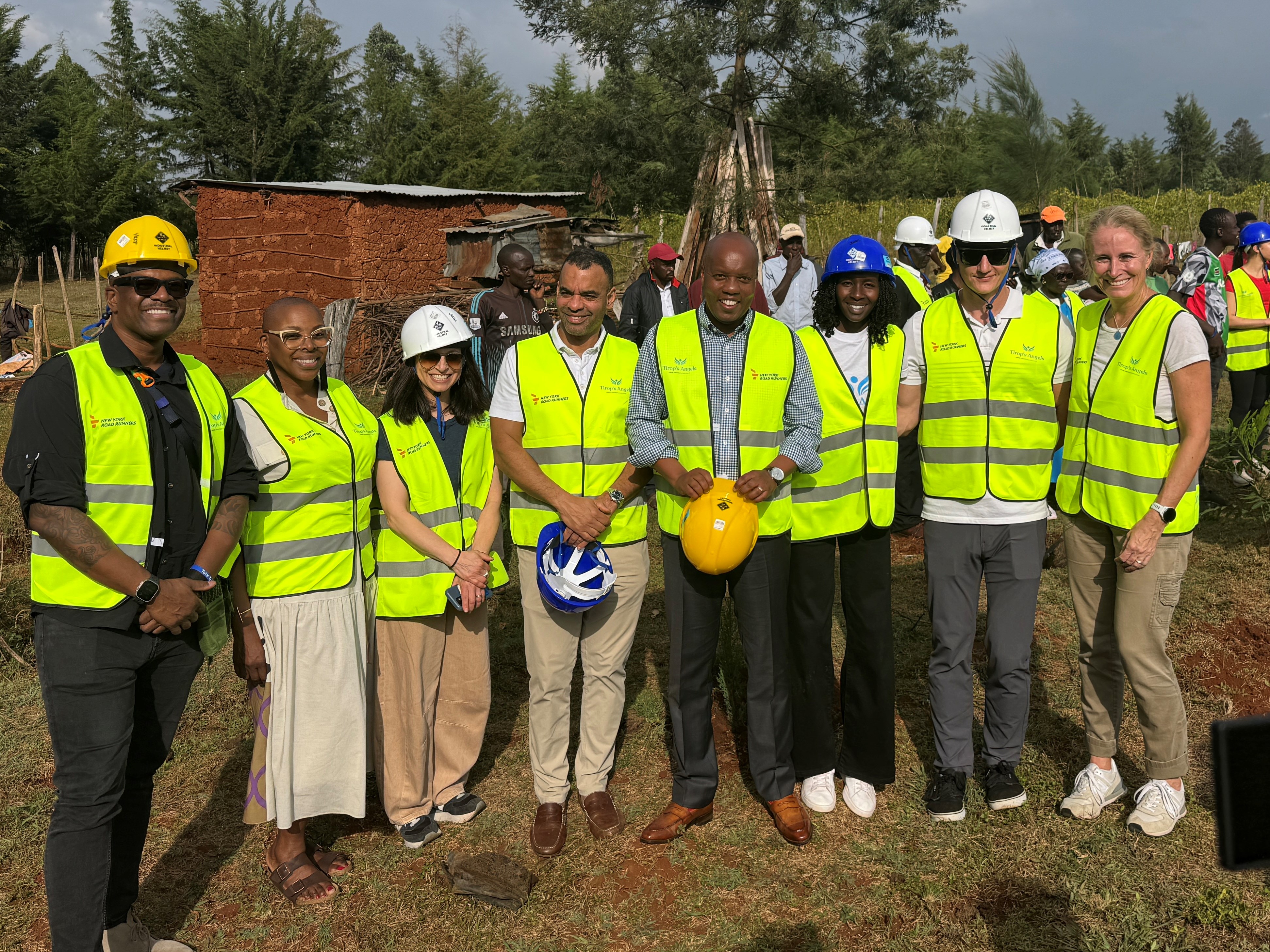 NYRR team and Viola Cheptoo at construction site of future Tirop's Angels safe house.
