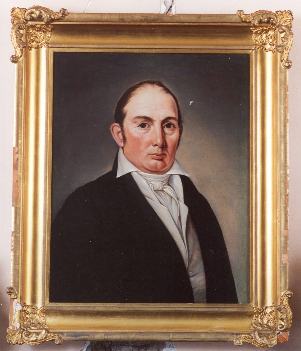 framed portrait with obscured face