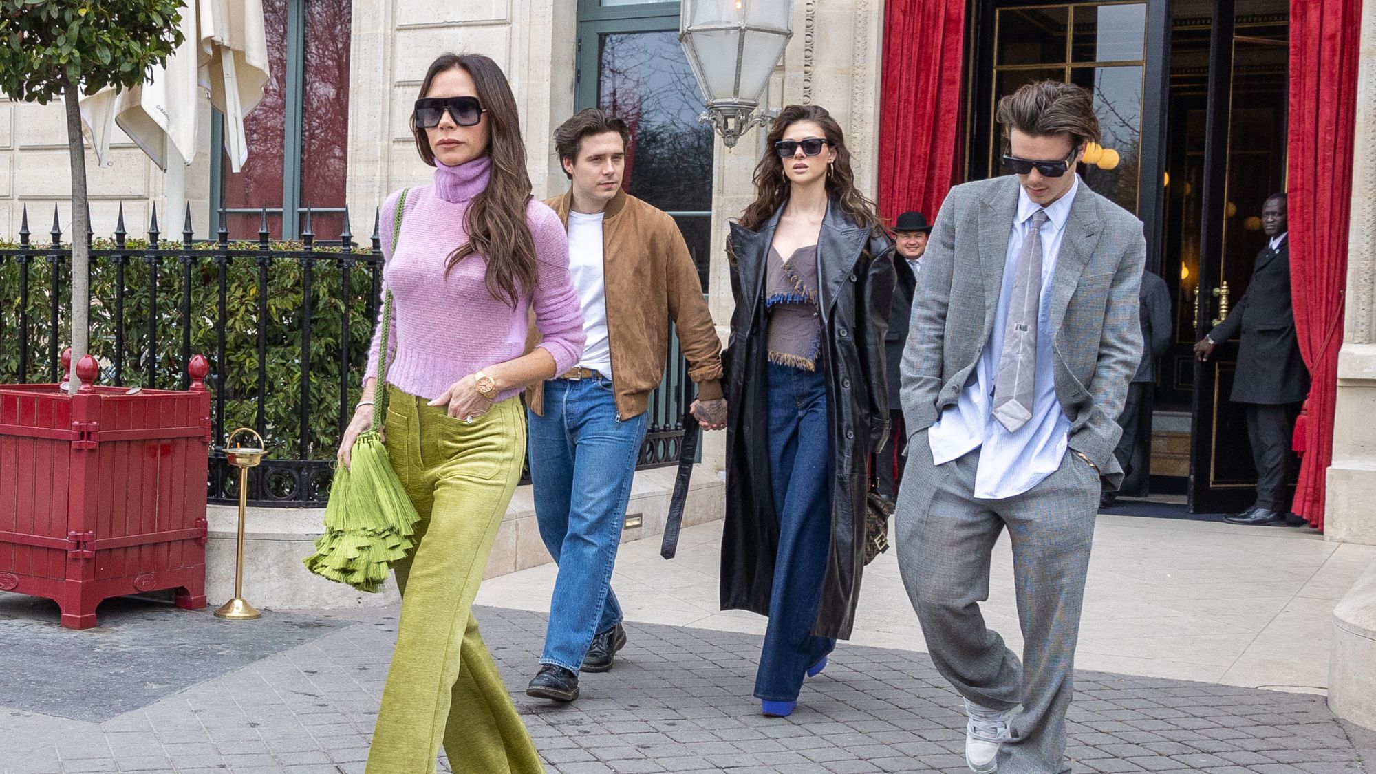 Victoria Beckham, Cruz Beckham and Brooklyn and Nicola Peltz Beckham at Paris Fashion Week