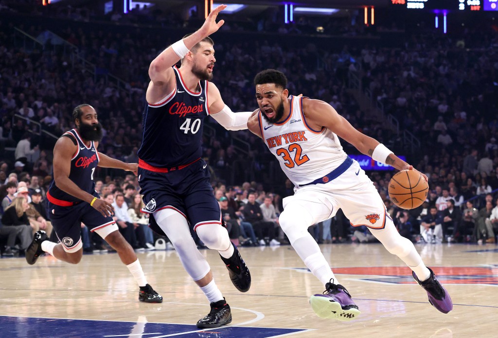 New York Knicks center Karl-Anthony Towns drives to the basket as LA Clippers center Ivica Zubac defends during the first quarter.
