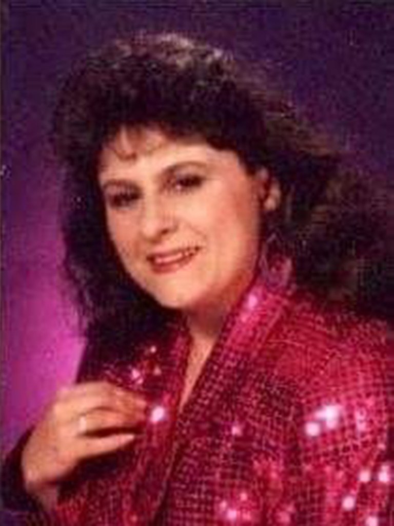 Michelle Hundley Smith in a red sequined jacket.