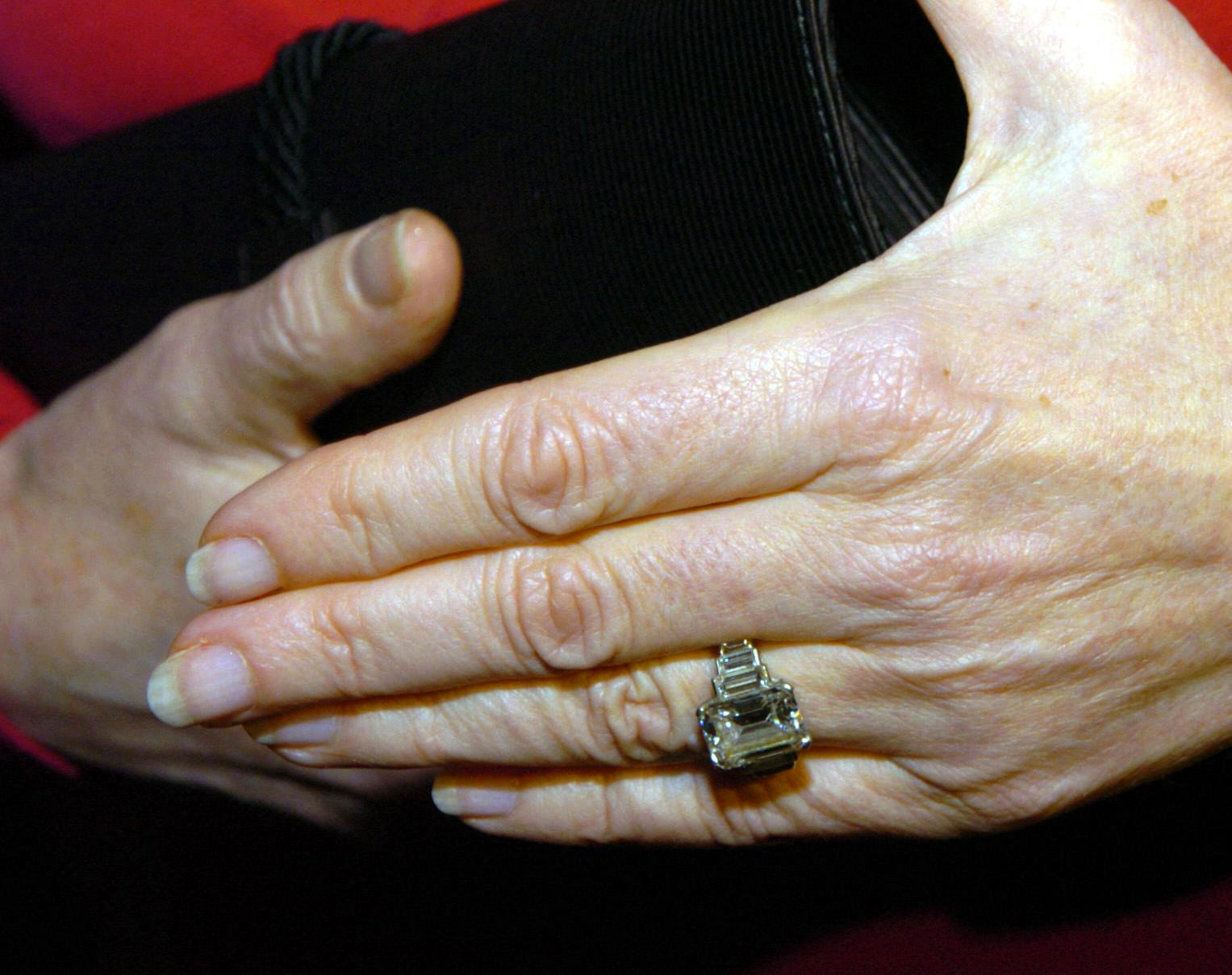 Queen Camilla's hands showing her engagement ring