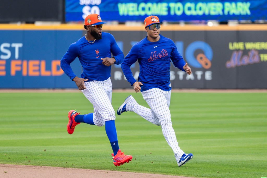 New York Mets’ Luis Robert Jr. (l.) and Juan Soto run during Spring Training at Clover Field.