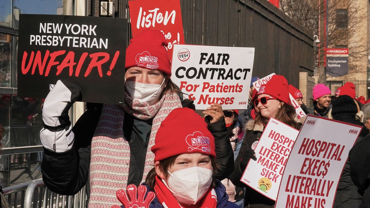 Striking nurses walk a picket line outside NewYork Presbyterian Hospital in New York, Monday, Feb. 9, 2026. (AP Photo/Richard Drew)