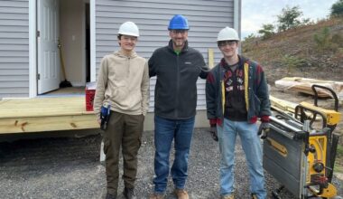 Saugerties counselor Michael Catalano with Ulster BOCES students at a Habitat for Humanity building site. 