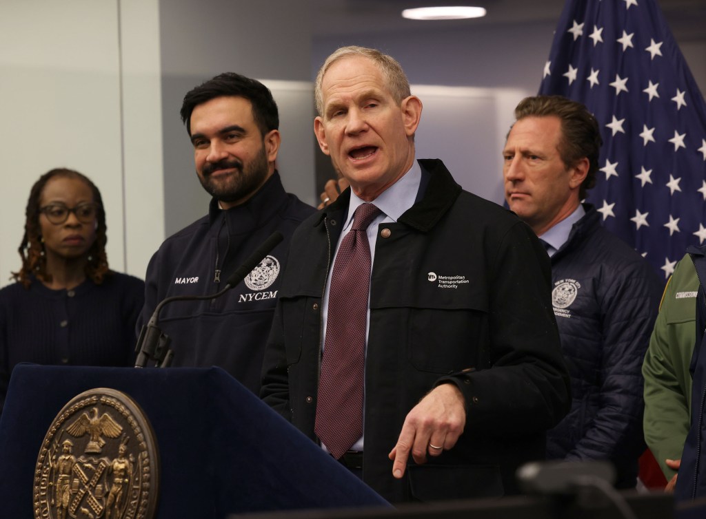 MTA CEO Janno Lieber giving a briefing on an incoming snowstorm, flanked by NYC Mayor Zohran Mamdani and NYCEM Zachary Iscol.