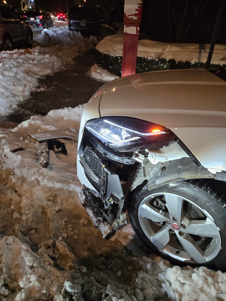 a car where the front end was damaged bya plow