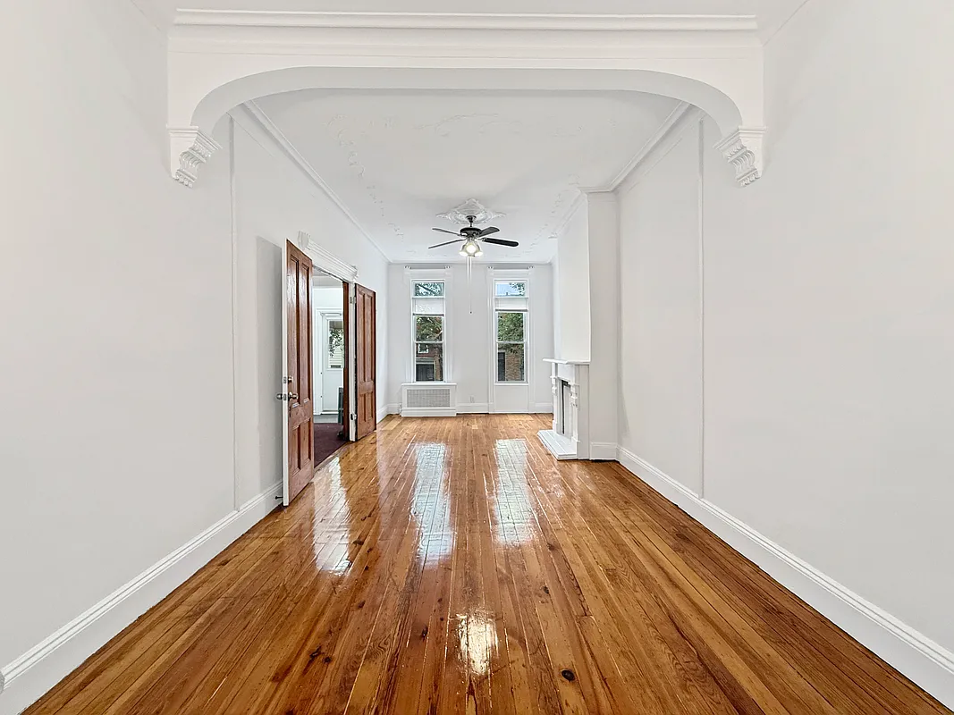interior with wood floor and a mantel