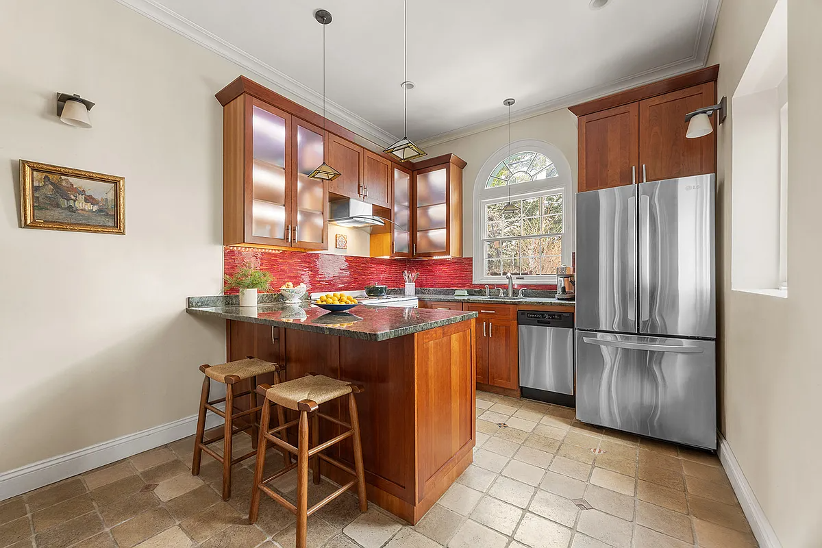 kitchen with tile floor, wood cabinets