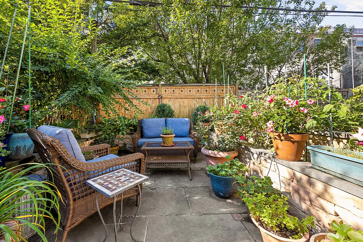 rear yard with some raised planters, room for seating