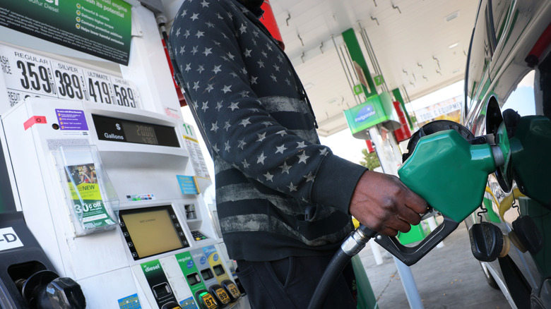 A person prepares to pump gas at a BP gas station on Coney Island Avenue on October 19, 2022 in the Flatbush neighborhood of Brooklyn borough in New York City.