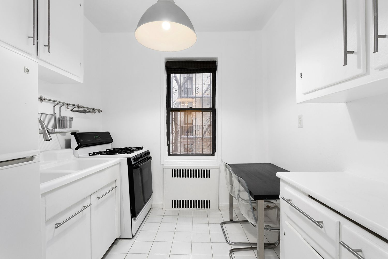 kitchen with white cabinets, white tile floor