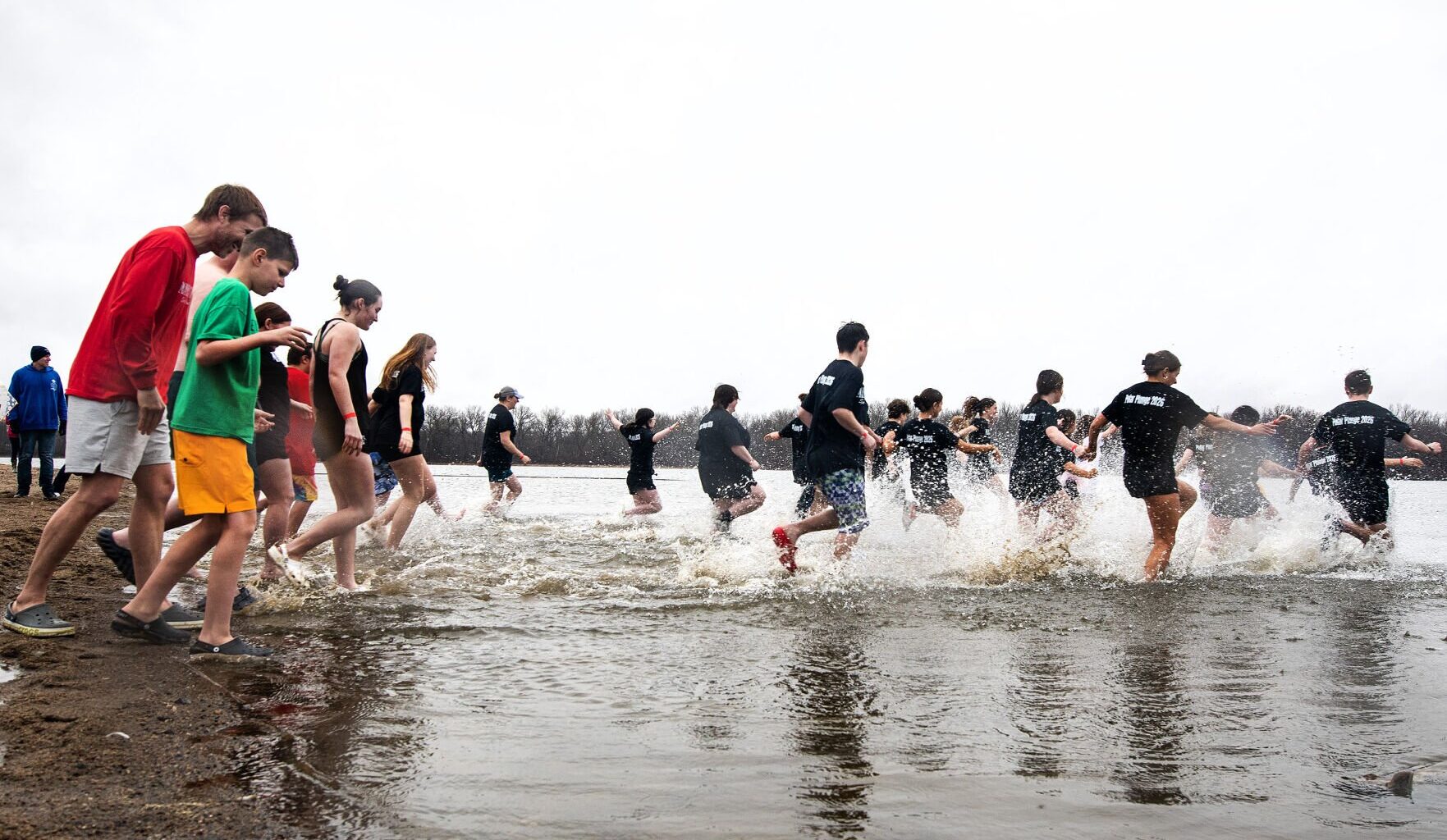 Plungers brave the rain to benefit Special Olympics