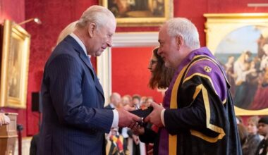 kng charles presents nick jennings with a medal