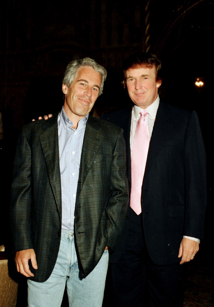 Jeffrey Epstein (left) and Donald Trump pose together at Mar-a-Lago in 1997.