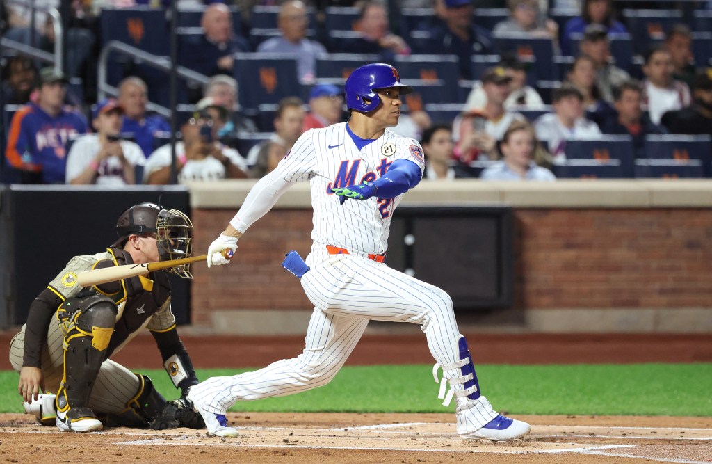 New York Mets right fielder Juan Soto #22 hits a single.